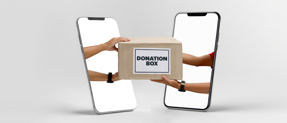 Hands,Holding,Donation,Box,Pop,Out,From,Two,Smartphones,Facing