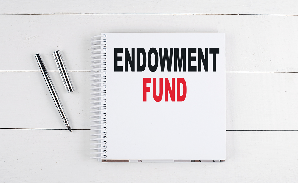 Endowment,Fund,Text,Written,On,Notebook,On,The,Wooden,Background