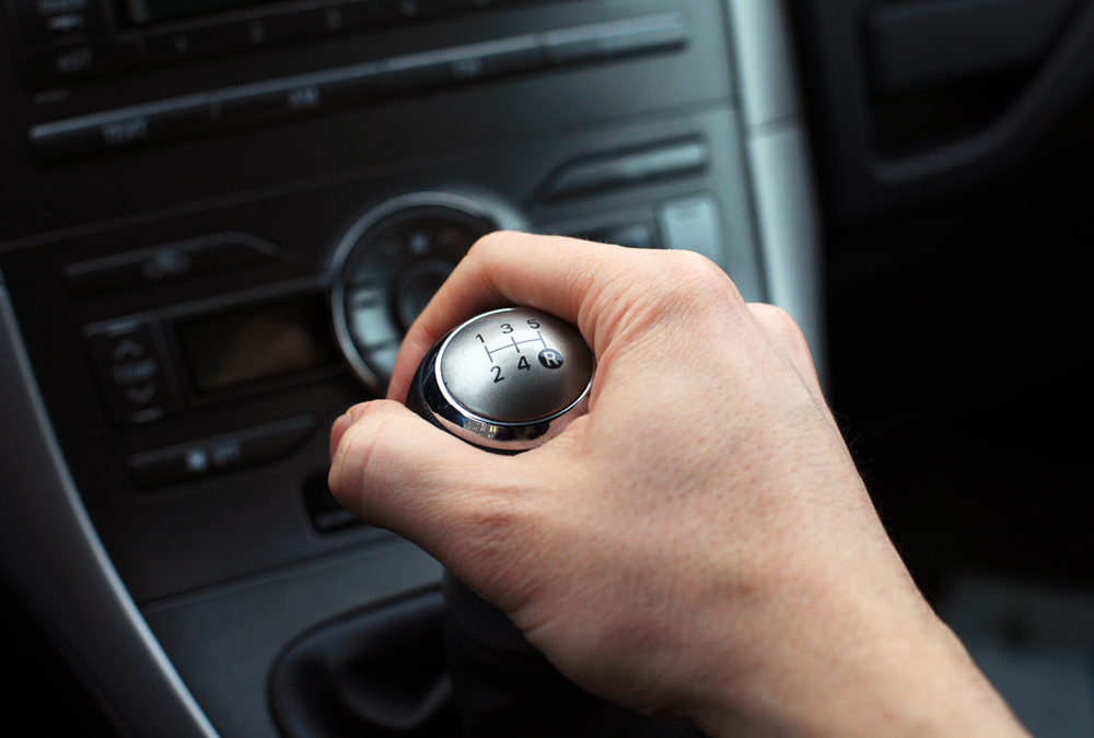 Close,Up,Of,Hand,On,Manual,Gear,Shift,Knob