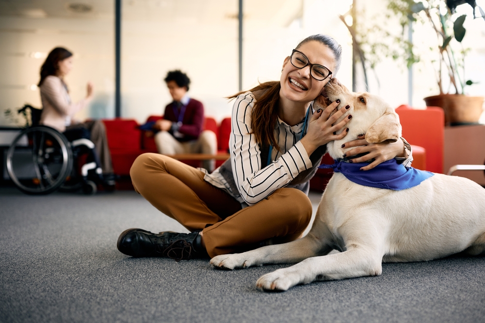 Happy,Entrepreneur,Embracing,Her,Labrador,Therapy,Dog,And,Having,Fun