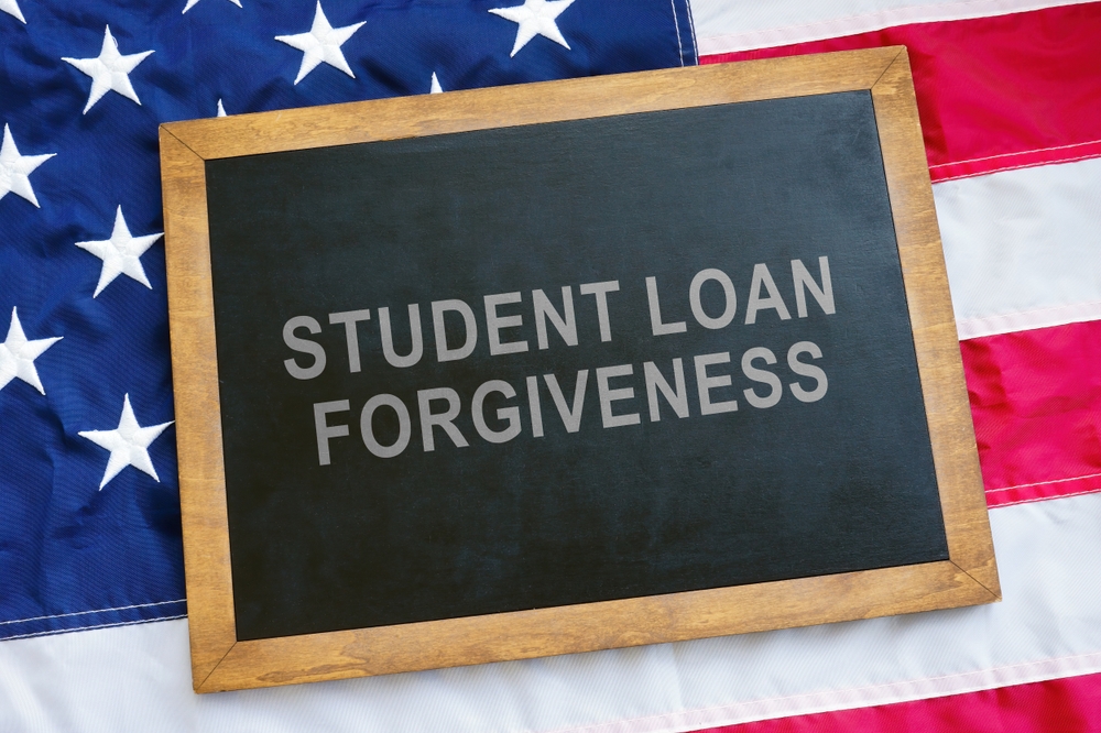 Student,Loan,Forgiveness,Concept.,Usa,Flag,And,Blackboard,On,It.