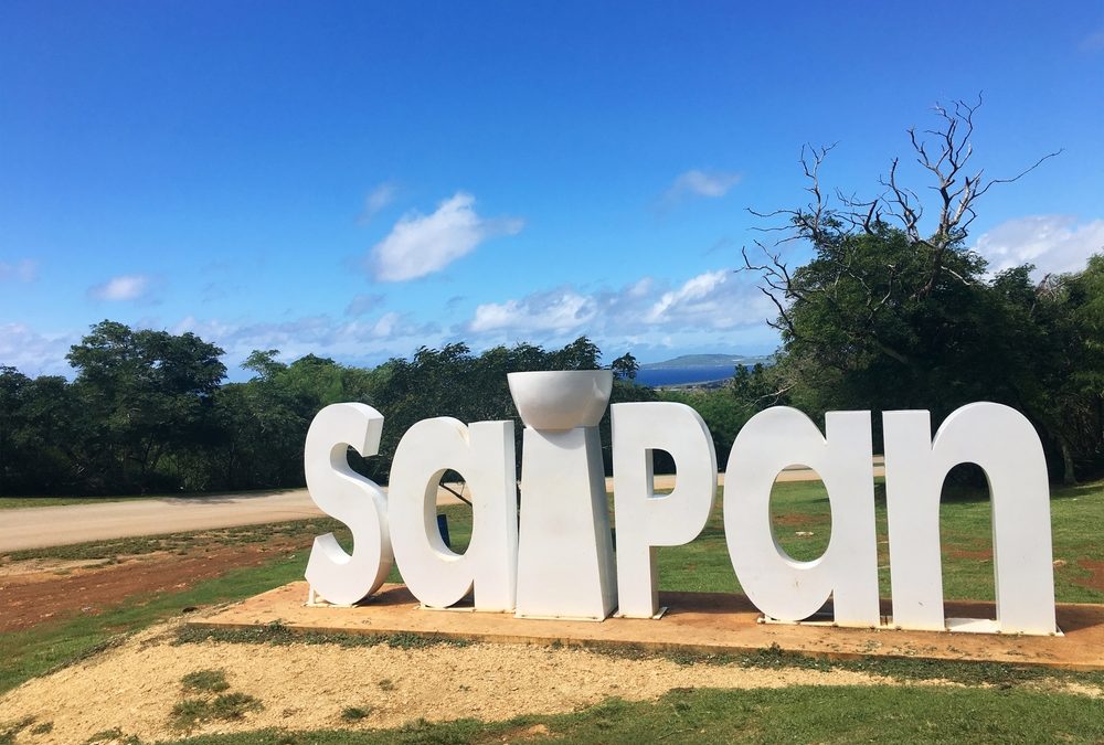 Saipan,Landmark,Building,Lue,Sky,,White,Clouds,And,Green,Grass