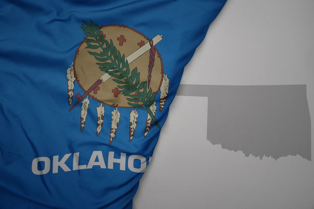 Big,Waving,National,Colorful,Flag,And,Map,Of,Oklahoma,State