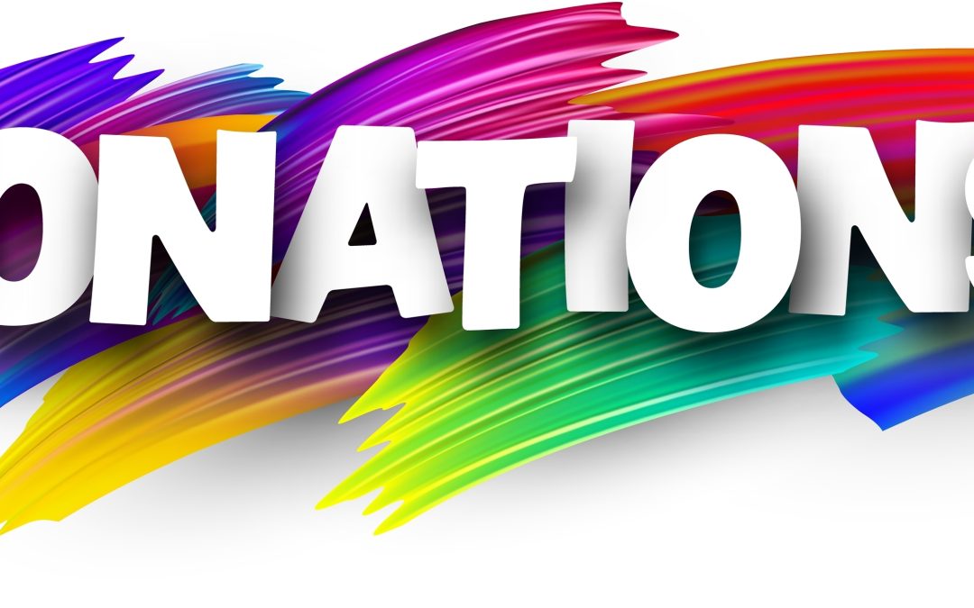 Donations,Paper,Word,Sign,With,Colorful,Spectrum,Paint,Brush,Strokes