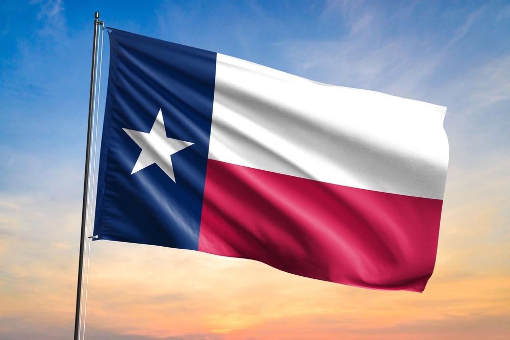 Flag,Of,Texas,Waving,Flag,On,Sunset,View