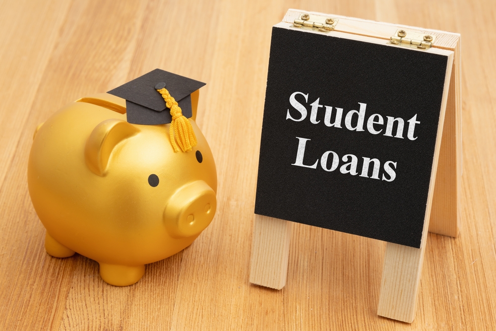 Student,Loans,With,A,Gold,Piggy,Bank,With,A,Grad