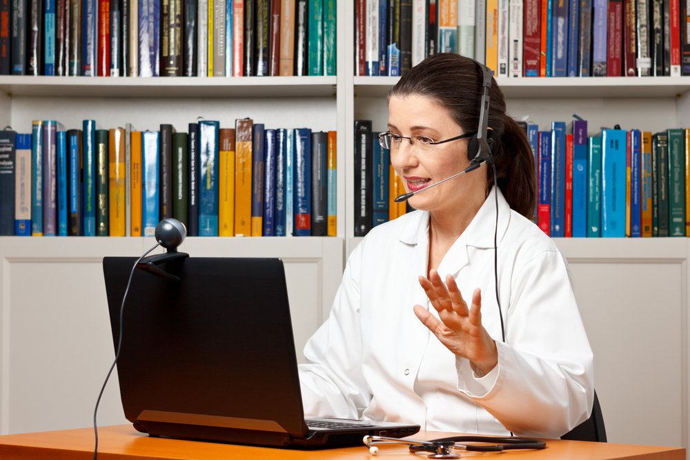 Doctor,Or,Vet,Sitting,With,A,Headset,Or,Headphones,At